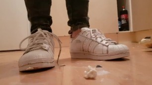 Stepping & Spitting in well Worn White Adidas Trainers and Gold Boots